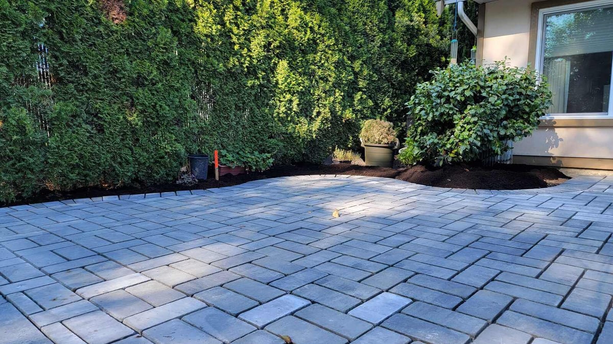 23_Detailed view of landscaped garden beds and custom paver patio by Back40 Landscaping in Abbotsford, BC