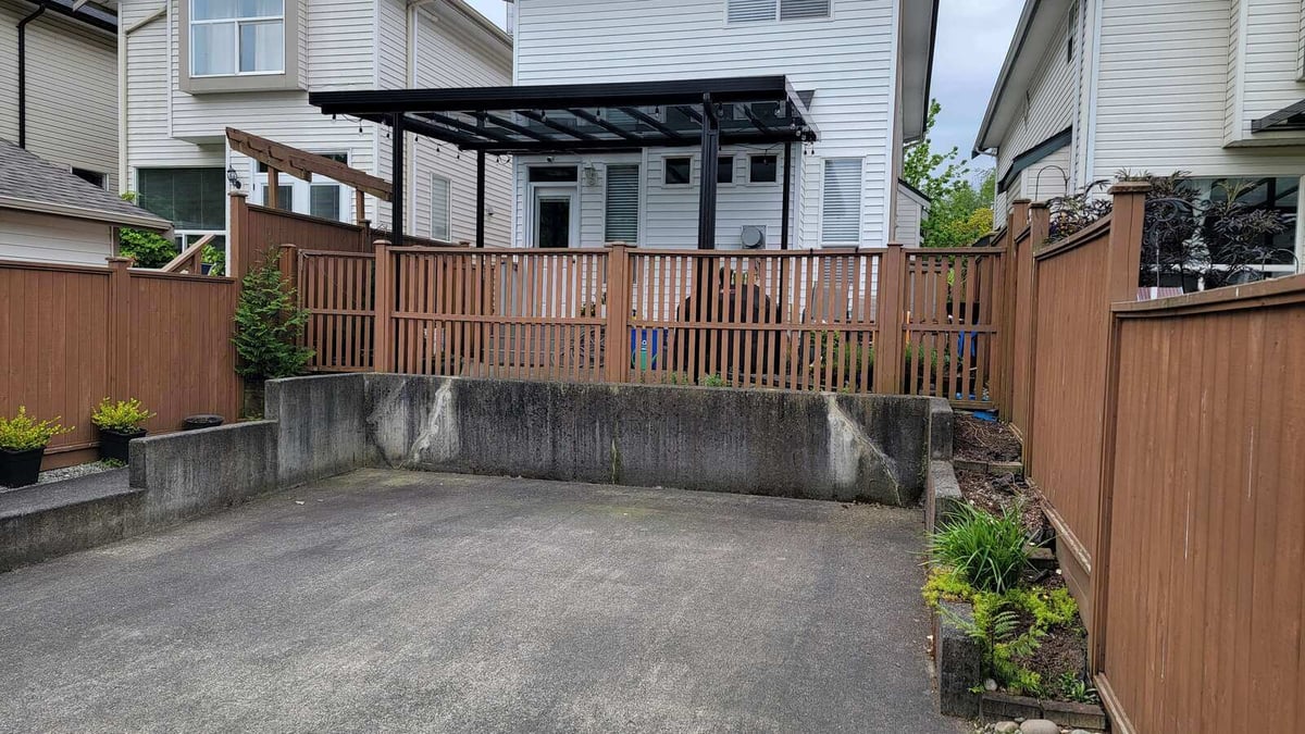 Backyard retaining wall structure before removal in Langley, BC, completed by Back 40 Landscaping