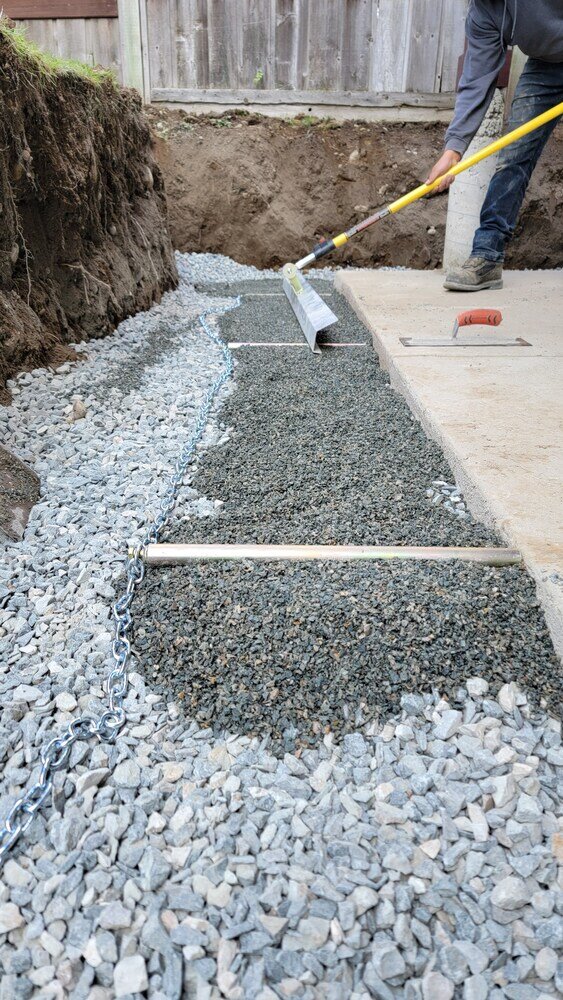 9_Flagstone patio construction progress with gravel foundation in a Mission, BC backyard by Back40 Landscaping